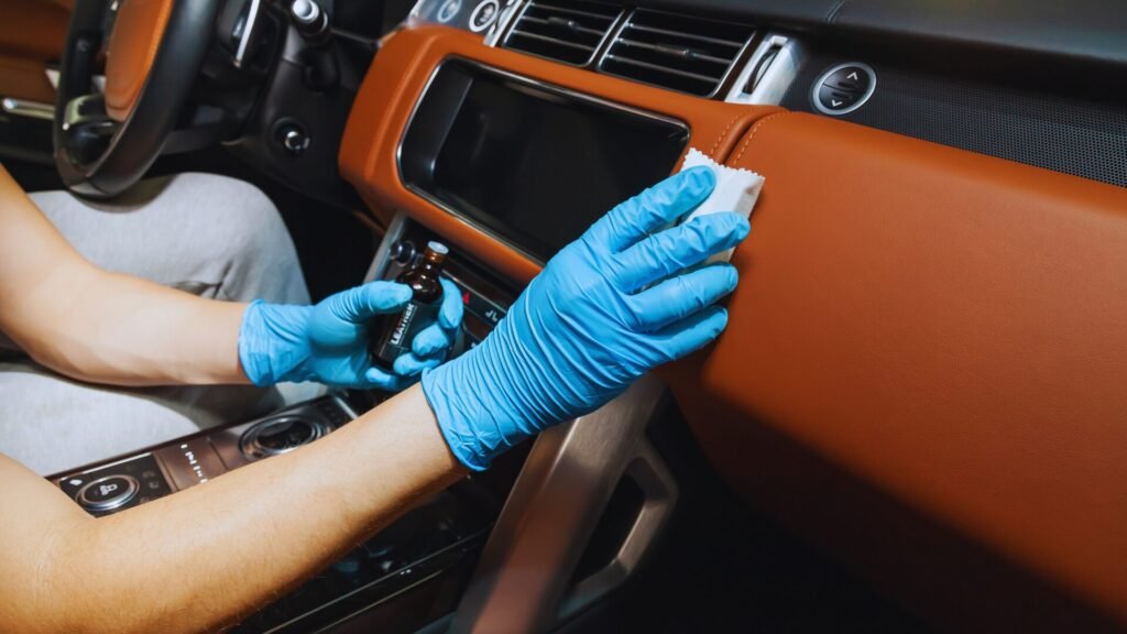 Squeegee application for ceramic coating Bronx NY car.