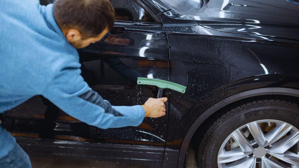 Squeegee work for ceramic coating installation in Westchester NY.