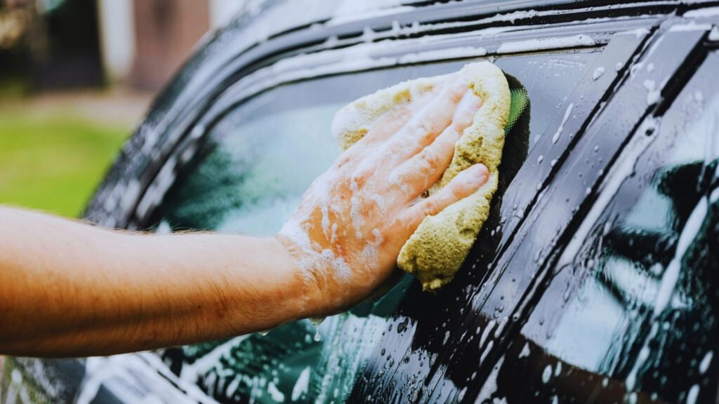 Pro technician doing mobile detailing near me on black car