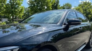 Shiny black car after exterior detailing